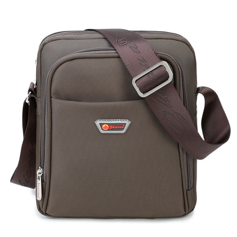 Brown shoulder bag with a visible brand logo on a white background