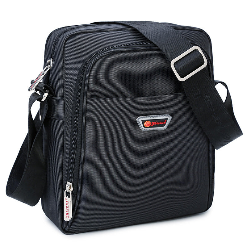 Black shoulder bag with a visible brand logo on a white background