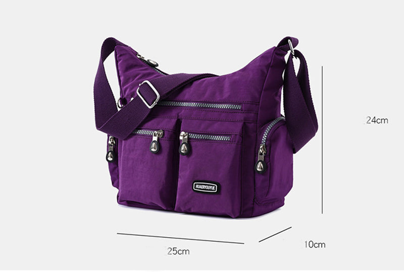 Purple shoulder bag with measurements on a white background