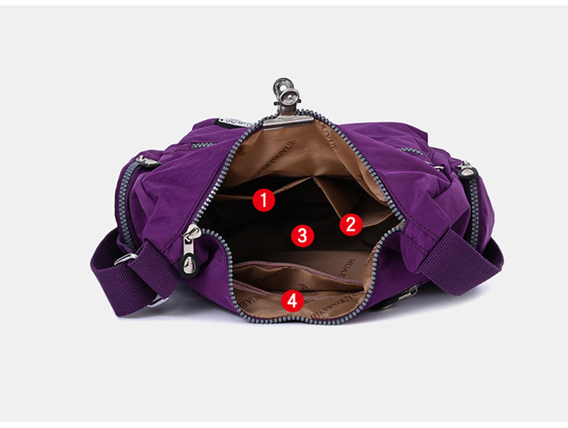 Purple handbag with open compartments on a white background