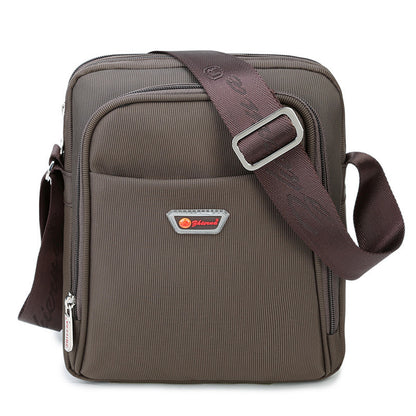 Brown shoulder bag with a visible brand logo on a white background