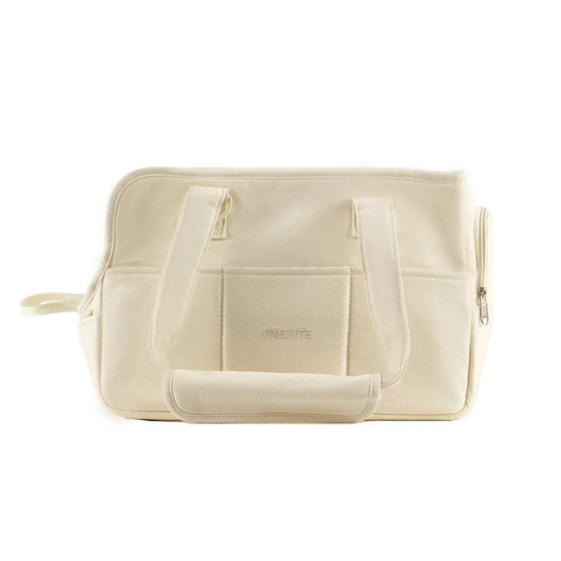 Beige travel bag with multiple compartments and zippers on a white background