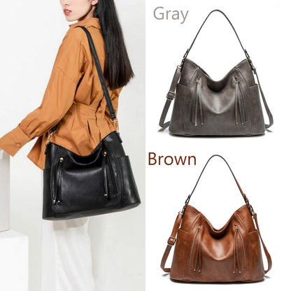 Woman holding a black handbag with gray and brown handbags displayed on a white background.