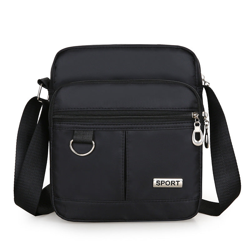 Black shoulder bag with 'SPORT' label on a white background