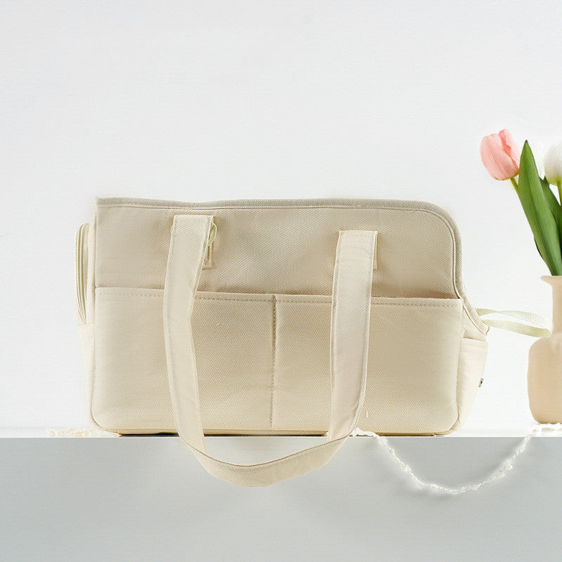 Beige tote bag with a vase of flowers on a light gray background