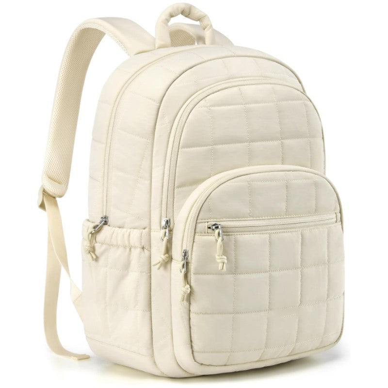 Beige quilted backpack on a white background