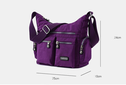 Purple shoulder bag with measurements on a white background